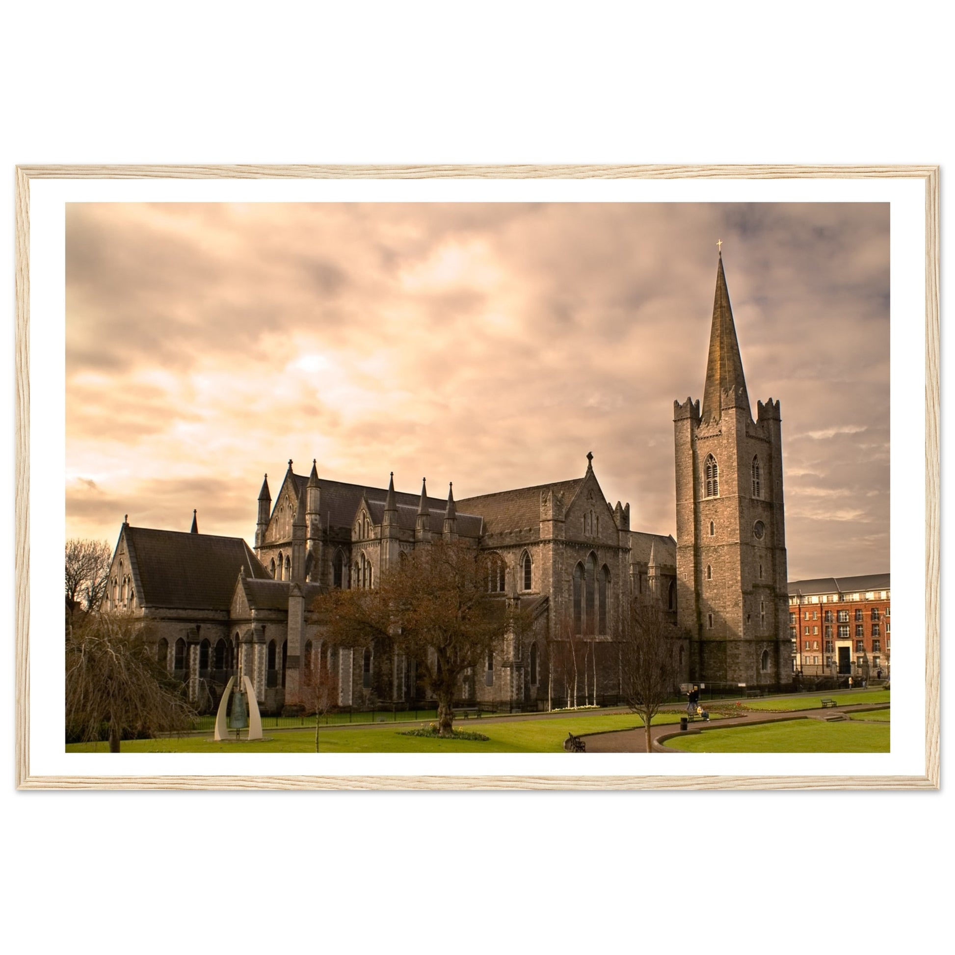 Framed print of St. Patrick's Cathedral in Dublin, showcasing its majestic Gothic architecture with detailed spires and intricate stonework. The serene scene captures the historic beauty of Ireland's largest cathedral, perfect for enhancing any living space.