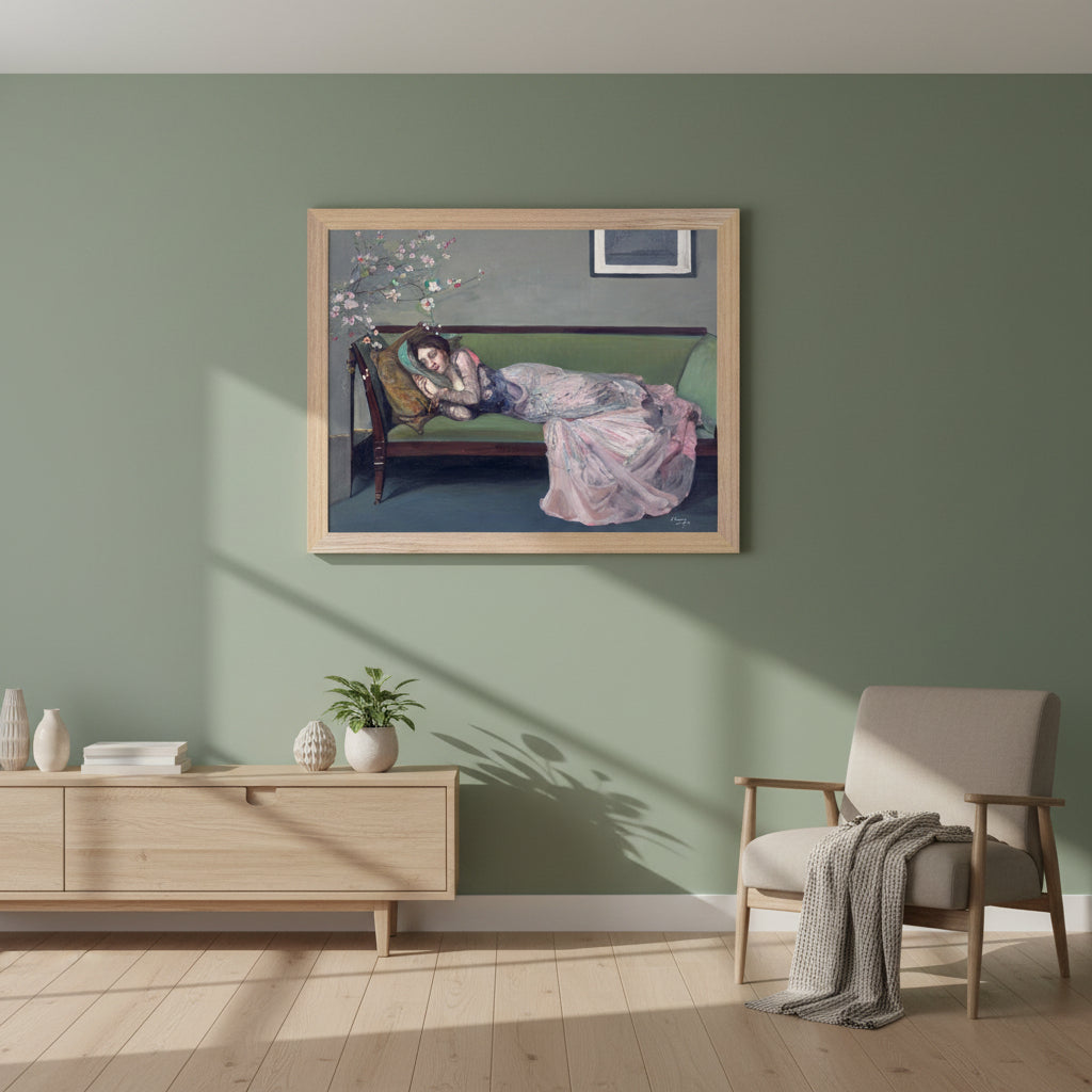 A3 framed print of The Green Sofa by Sir John Lavery in a natural oak-style gallery frame. natural wood frame, contemporary Irish home, sage green wall, soft morning light.