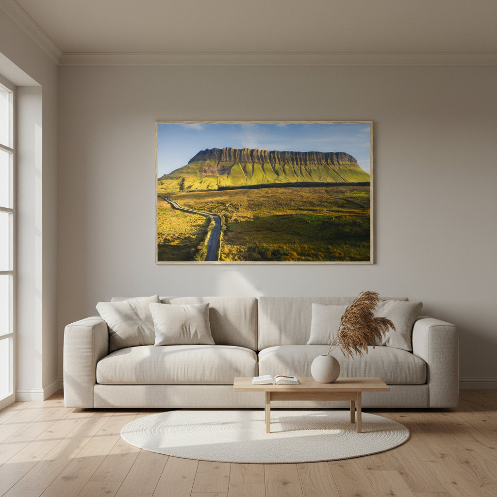 A 60×90 cm Gallery Edition framed print of Benbulben hanging above a linen sofa in a contemporary living room with oak floors, soft neutral tones, and natural daylight.