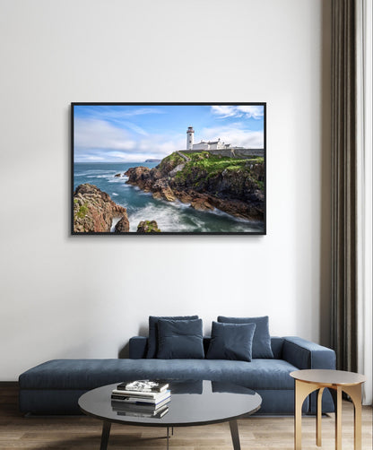 Capture the breathtaking beauty of Fanad Head Lighthouse in Co. Donegal, Ireland with our framed print. This captivating piece beautifully portrays the iconic landmark, offering a slice of Ireland's rugged coastal charm for your home decor.