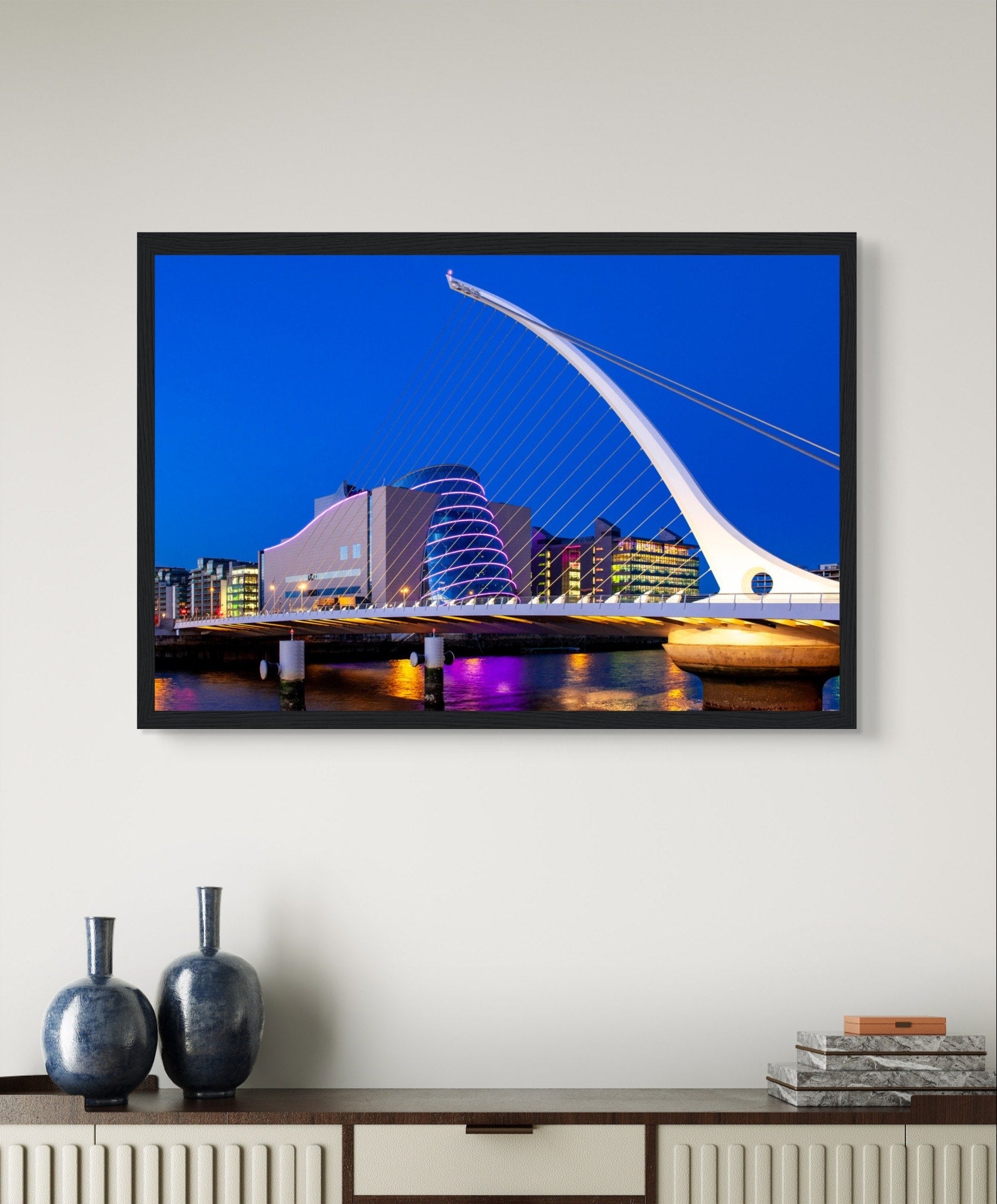 Enchanting Dublin skyline at night: Samuel Beckett Bridge & Convention Centre lights reflected on River Liffey. Framed art print captures city's magic.