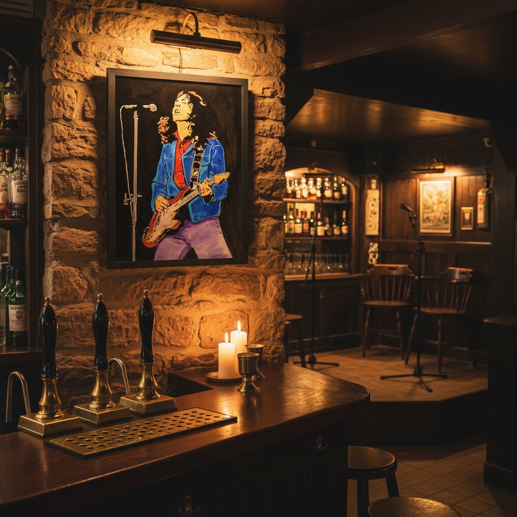 Framed print hanging on a stone wall in a cosy Irish pub with wooden bar, Guinness taps, candles, brass details, and live music stage vibes.