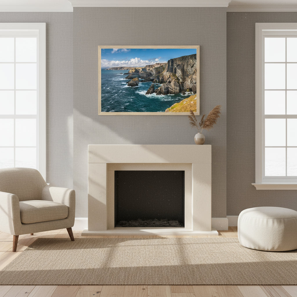 Mizen Head framed print above a limestone fireplace in a modern Irish coastal home, soft grey walls, linen textures, Atlantic light streaming through sash windows.