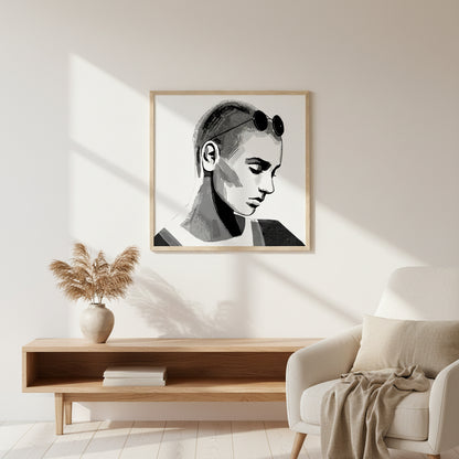 Sinéad O’Connor portrait in a natural oak wooden frame, displayed in a Scandinavian interior with warm neutral tones, soft sunlight, organic textures, premium gallery-style