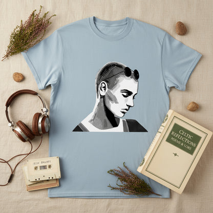 Sinead O’Connor T-shirt laid flat on linen cloth beside headphones, cassette tapes, and Irish poetry book. Artistic composition, heritage colour palette.