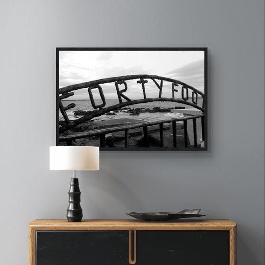 Vibrant coastal scene capturing the beauty of The Forty Foot in Dublin, featuring the iconic Martello tower and swimmers against a backdrop of serene waters.