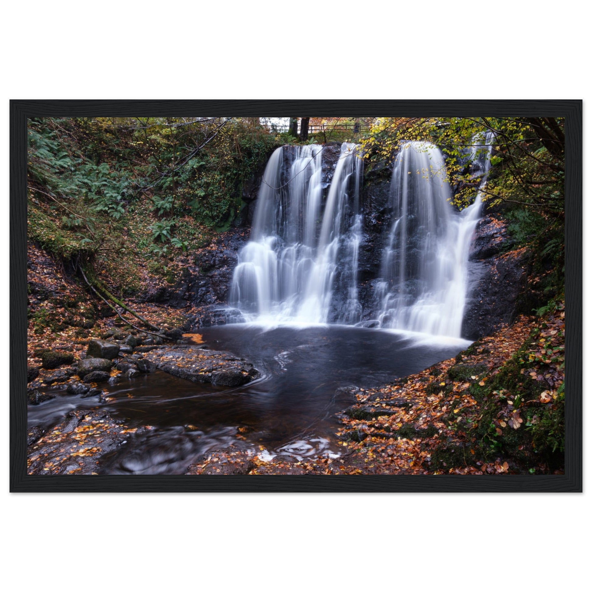 Stunning framed print of Glenariff Waterfall, located in the picturesque Glens of Antrim, Northern Ireland. The cascading waters flow through lush greenery, capturing the serene beauty of nature. Perfect for home or office decor, this print adds a touch of tranquility