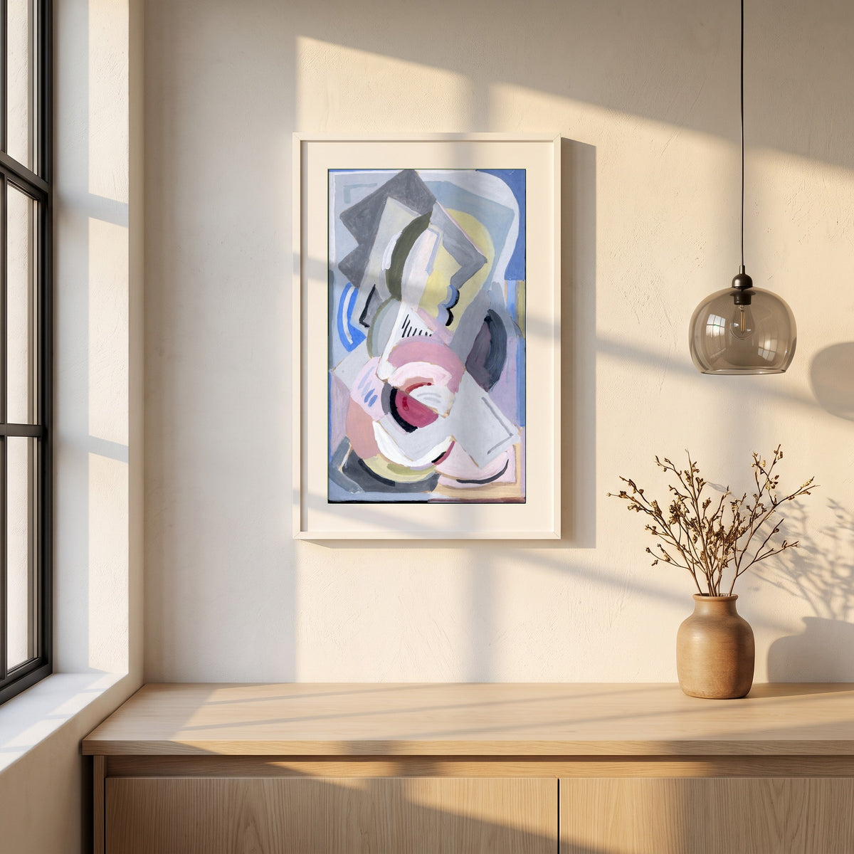 Abstract framed print in a white frame on a plaster wall above an oak worktop in a bright Scandinavian kitchen