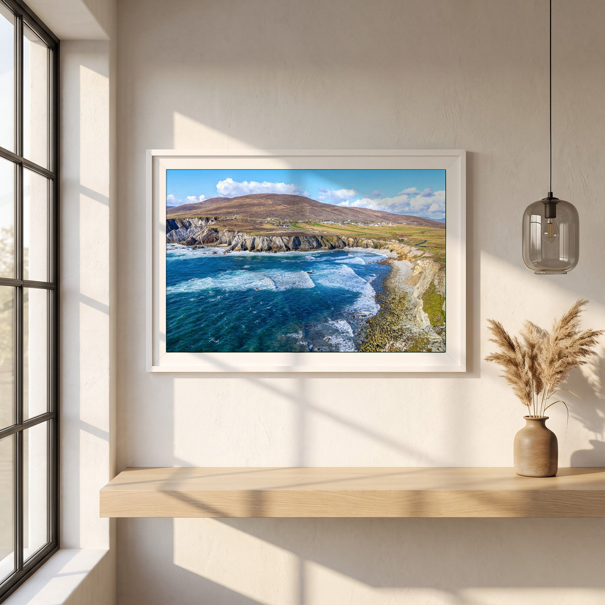 Achill Island Framed Print | Wild Atlantic Way, Co. Mayo framed print in a white frame on a plaster wall above an oak worktop in a bright Scandinavian kitchen