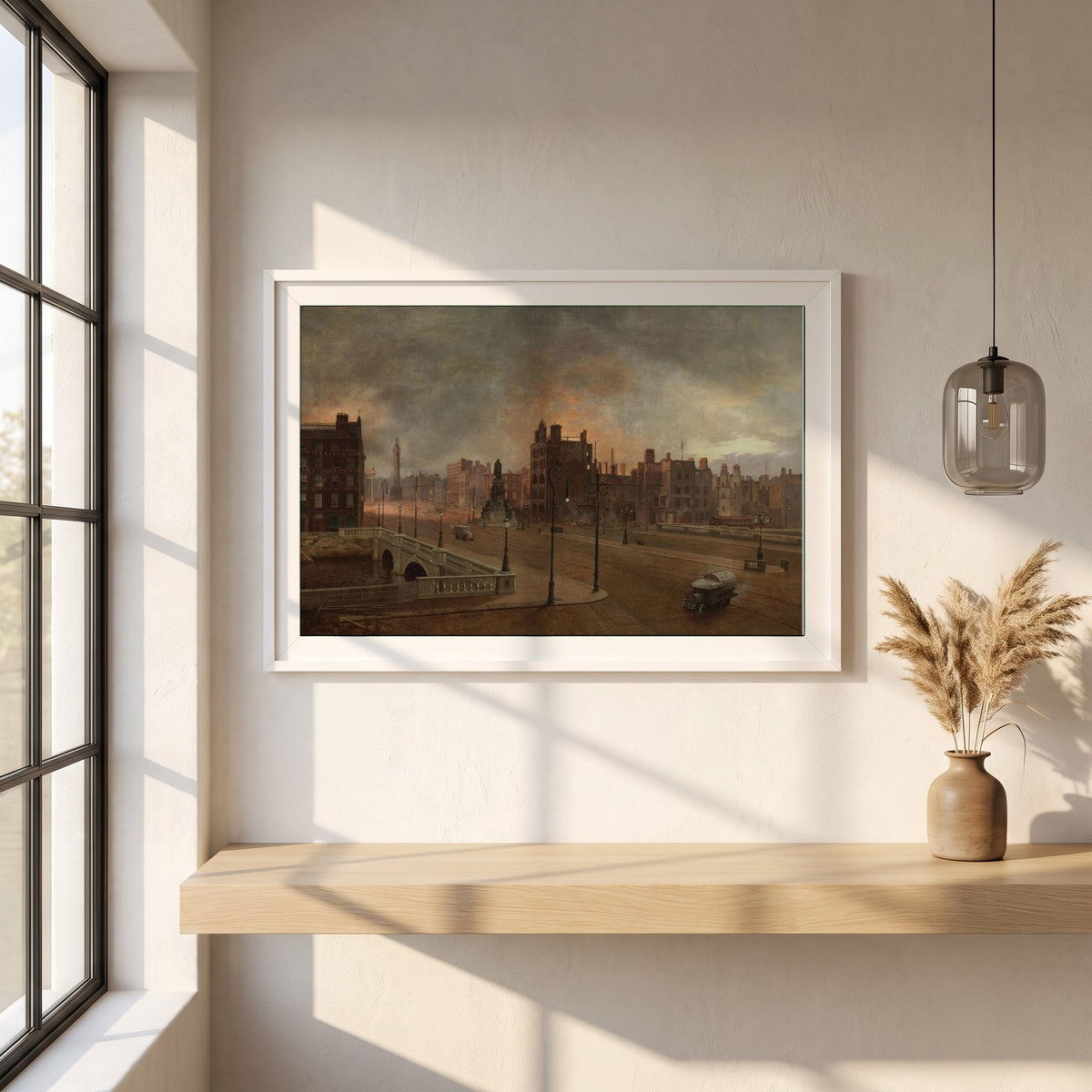 After the Bombardment framed print in a white frame on a plaster wall above an oak worktop in a bright Scandinavian kitchen
