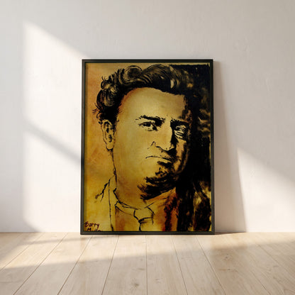 Brendan Behan framed print in a black frame leaning against a white plaster wall on oak floorboards in morning light