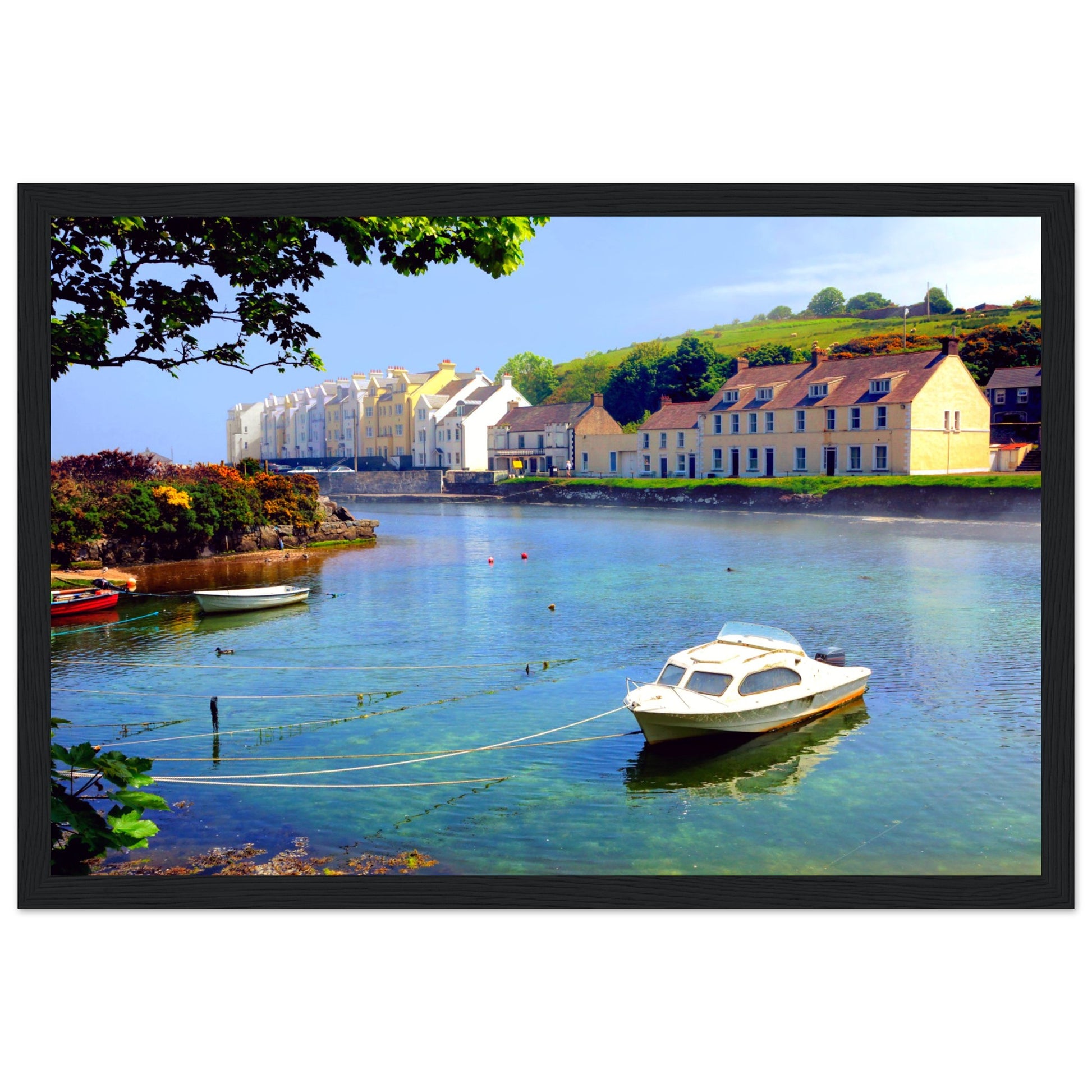 Serene coastal view of Cushendun, Northern Ireland at sunrise. Rustic wooden frame complements natural tones.