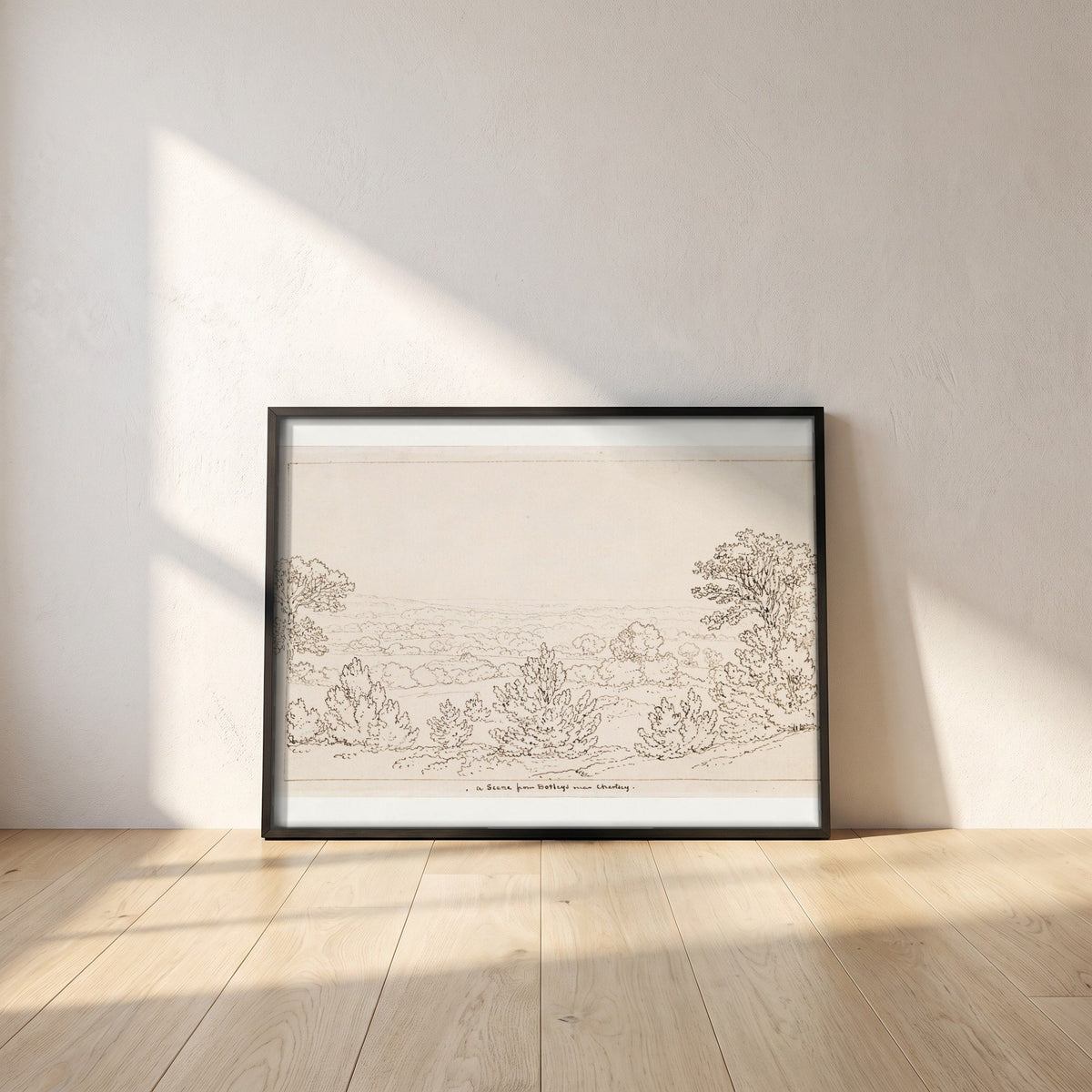 Chertsey, Surrey, from Botleys House framed print in a black frame leaning against a white plaster wall on oak floorboards in morning light