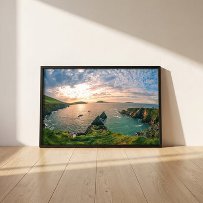 Dingle Peninsula framed print in a black frame leaning against a white plaster wall on oak floorboards in morning light