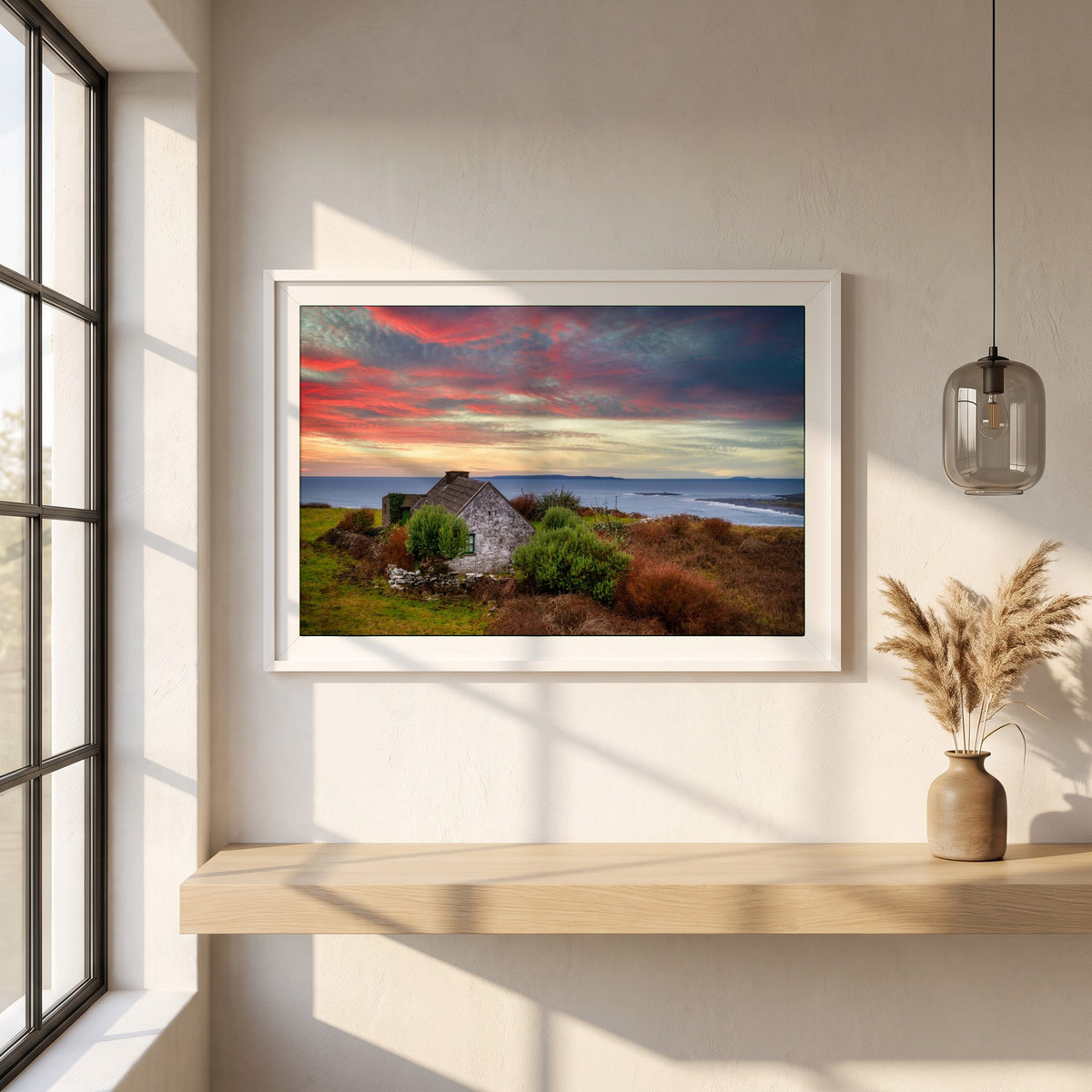 Doolin, Co. Clare framed print in a white frame on a plaster wall above an oak worktop in a bright Scandinavian kitchen
