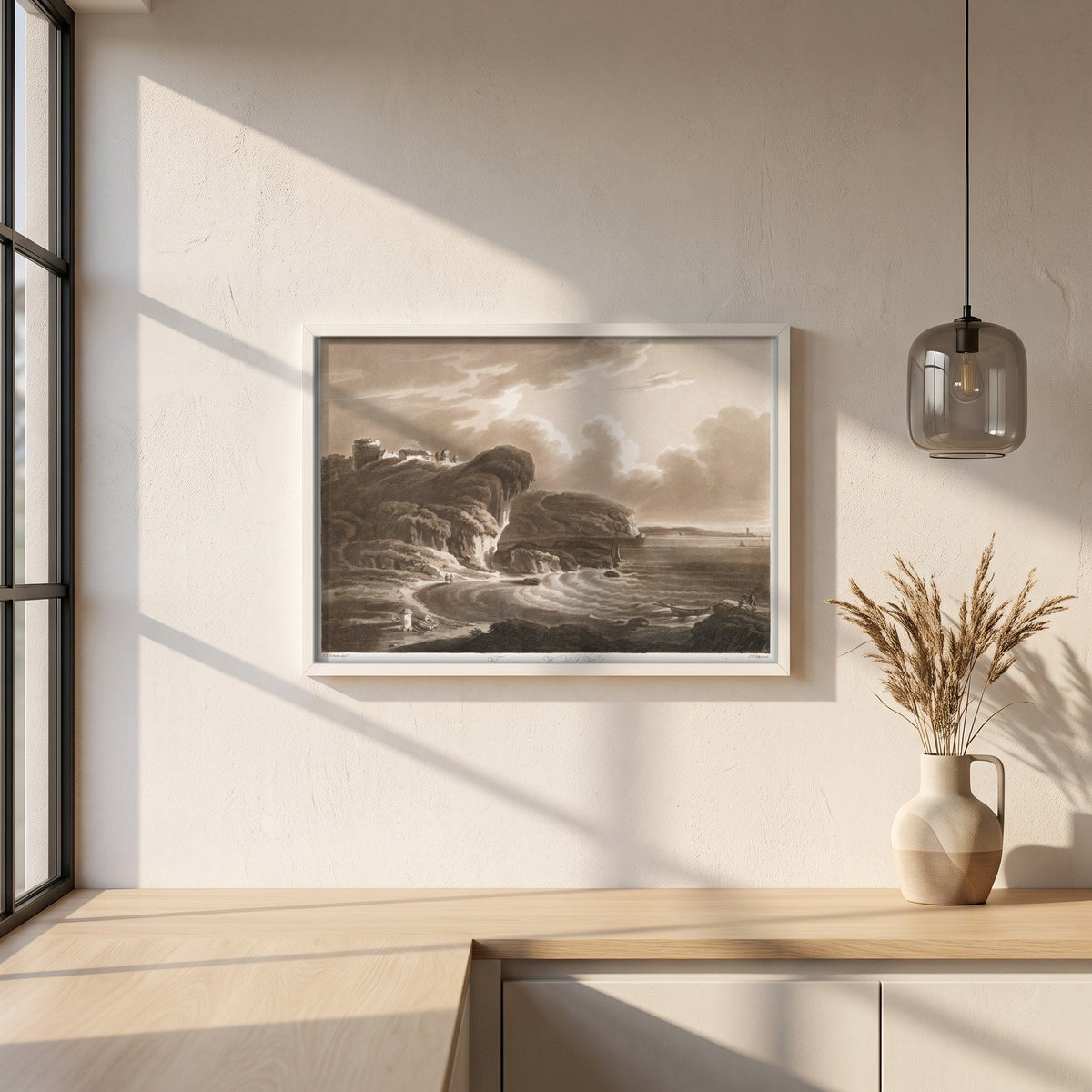 The Entrance to Waterford Harbour by Thomas Sautelle Roberts Art Print framed print in a white frame on a plaster wall above an oak worktop in a bright Scandinavian kitchen