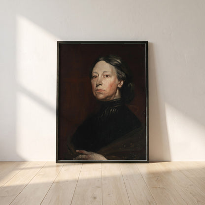 Augusta Lady Gregory framed print in a black frame leaning against a white plaster wall on oak floorboards in morning light