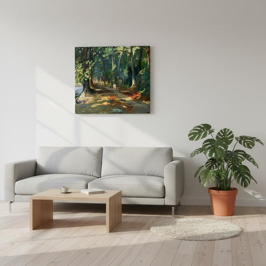 The Path by the River, Maidenhead canvas wall art displayed in a contemporary living room with a grey sofa, wooden coffee table, and a potted plant, featuring a forest painting on the wall.