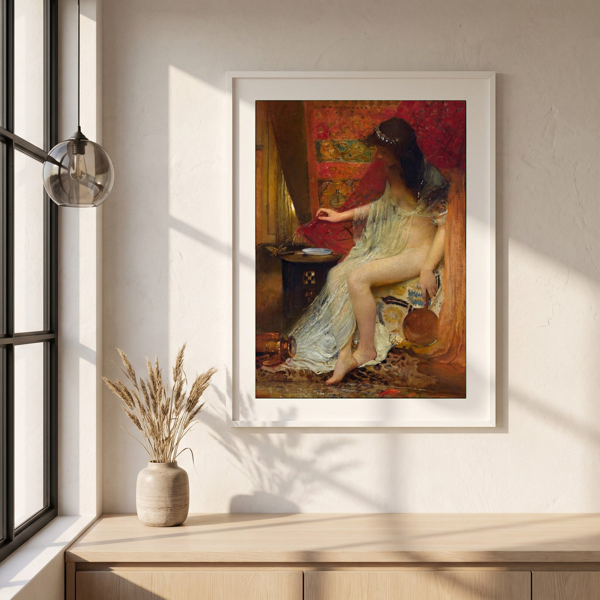 Lesbia's Sparrow framed print in a white frame on a plaster wall above an oak worktop in a bright Scandinavian kitchen
