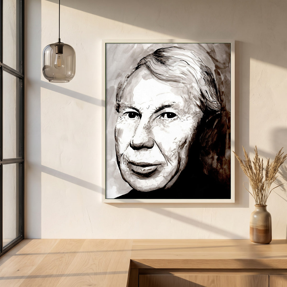Louis le Brocquy Portrait framed print in a white frame on a plaster wall above an oak worktop in a bright Scandinavian kitchen