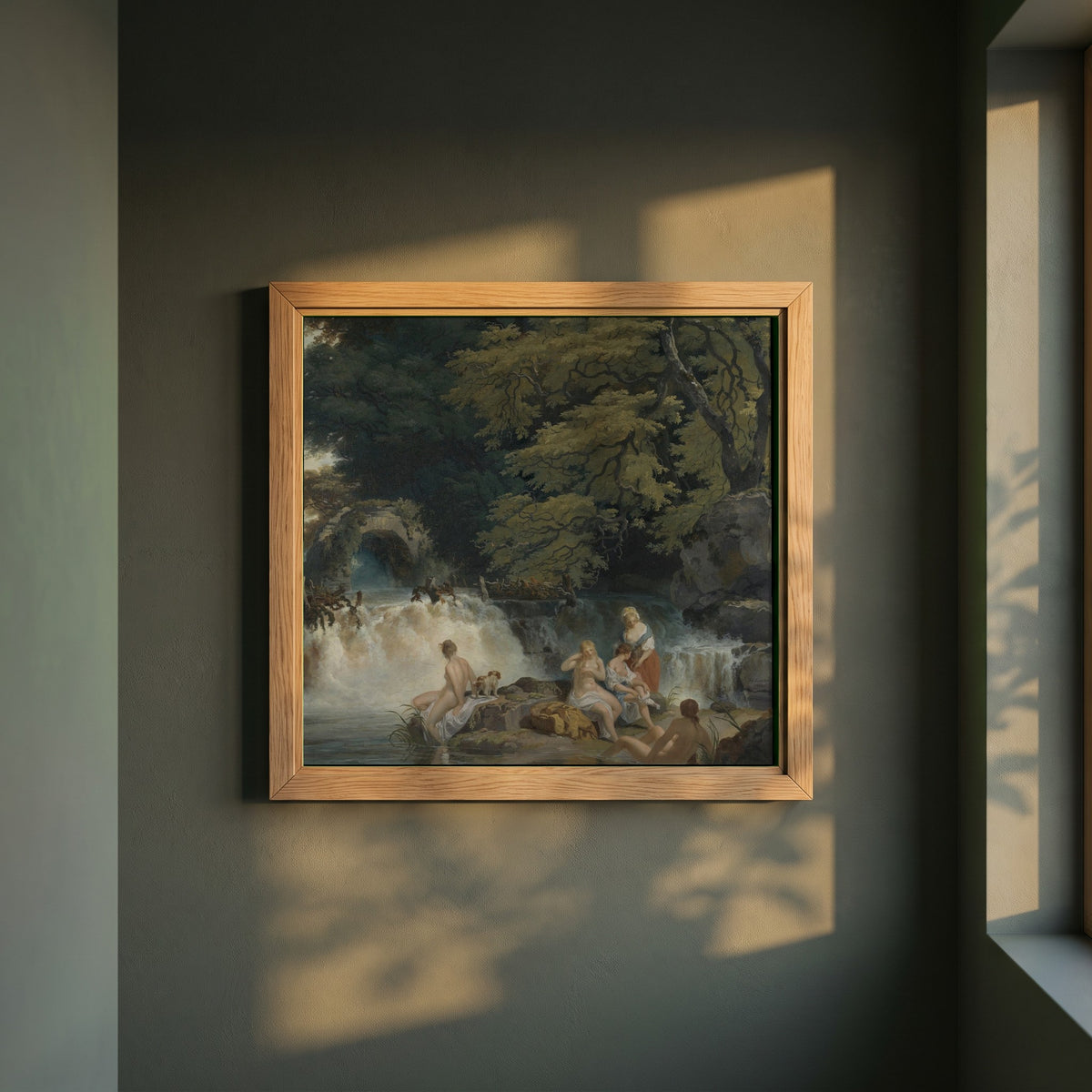 Nymphs Bathing framed print in a natural oak frame on a dark green wall beside a window, dappled plant shadow