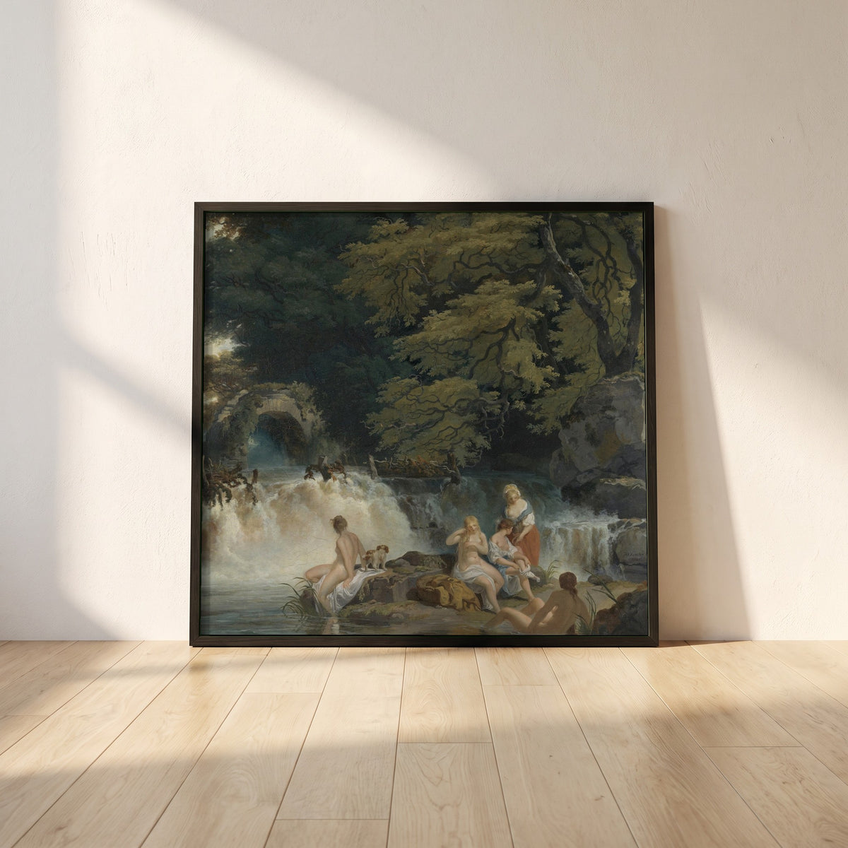 Nymphs Bathing framed print in a black frame leaning against a white plaster wall on oak floorboards in morning light