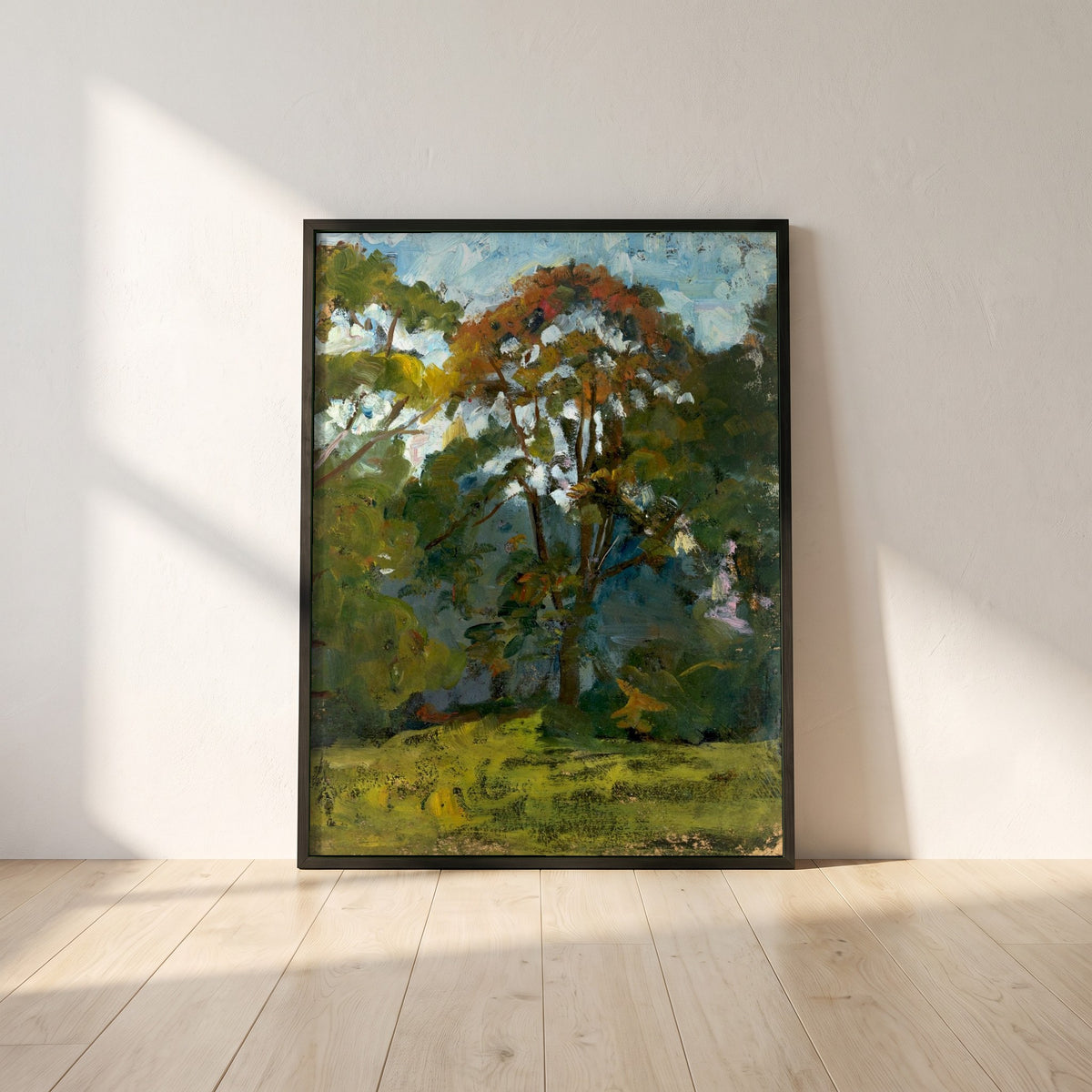 Sketch of Trees framed print in a black frame leaning against a white plaster wall on oak floorboards in morning light