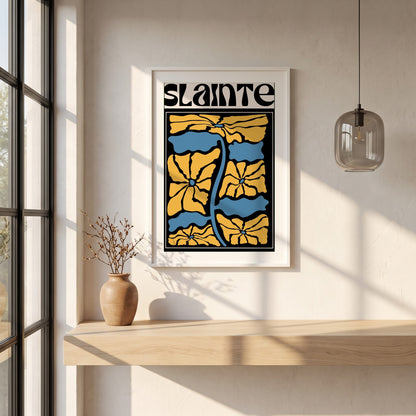 Sláinte framed print in a white frame on a plaster wall above an oak worktop in a bright Scandinavian kitchen