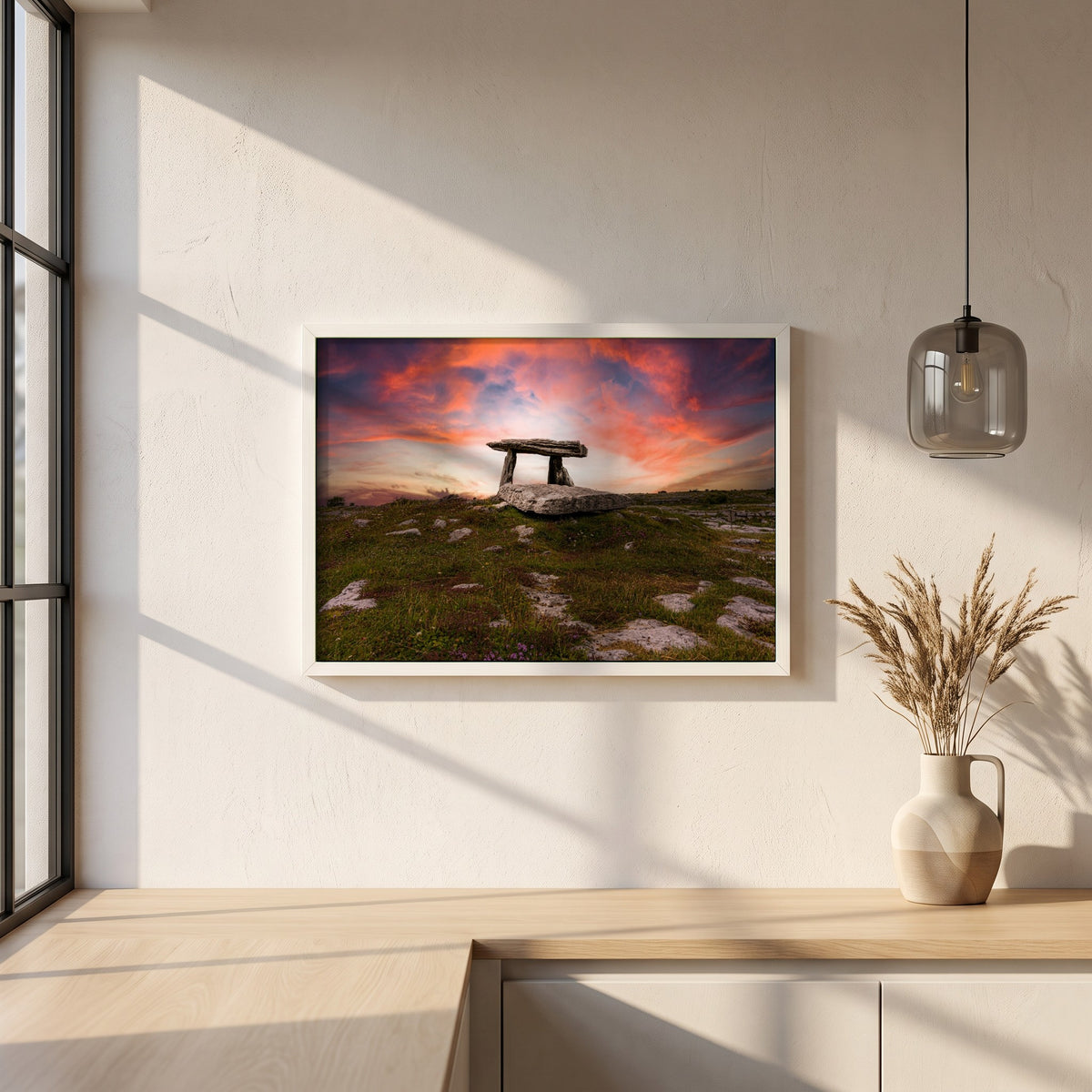 Poulnabrone Dolmen framed print in a white frame on a plaster wall above an oak worktop in a bright Scandinavian kitchen