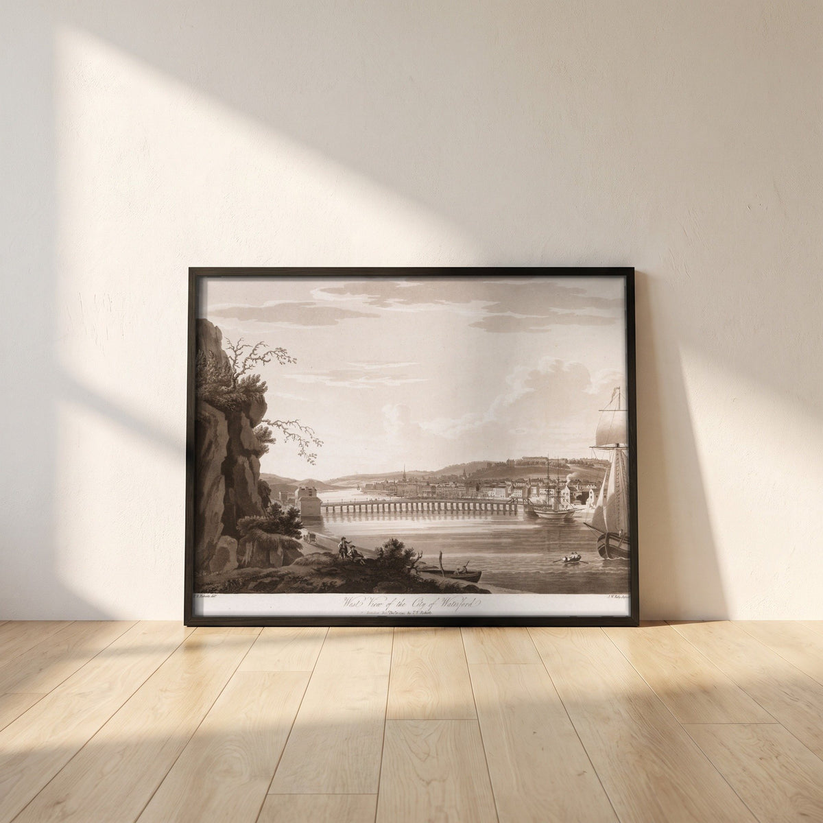 West View of the City of Waterford by Thomas Sautelle Roberts Art Print framed print in a black frame leaning against a white plaster wall on oak floorboards in morning light