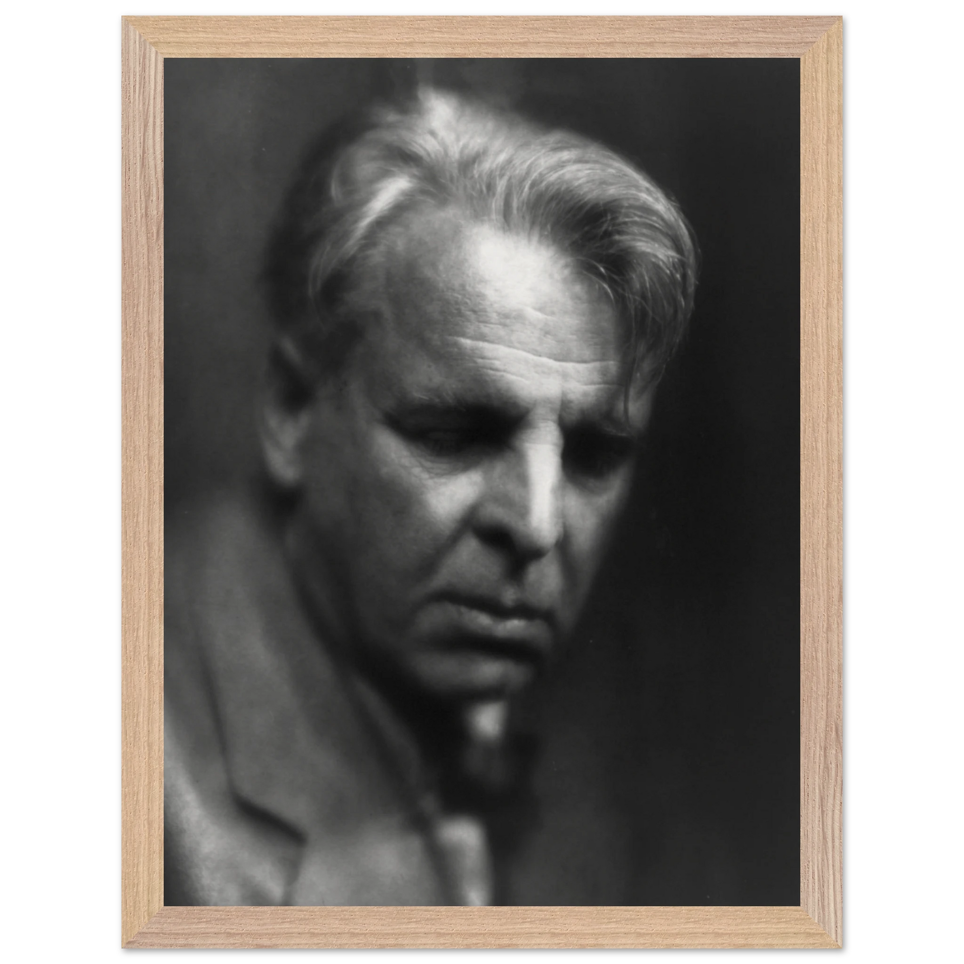 William Butler Yeats portrait displayed in home library or study setting.