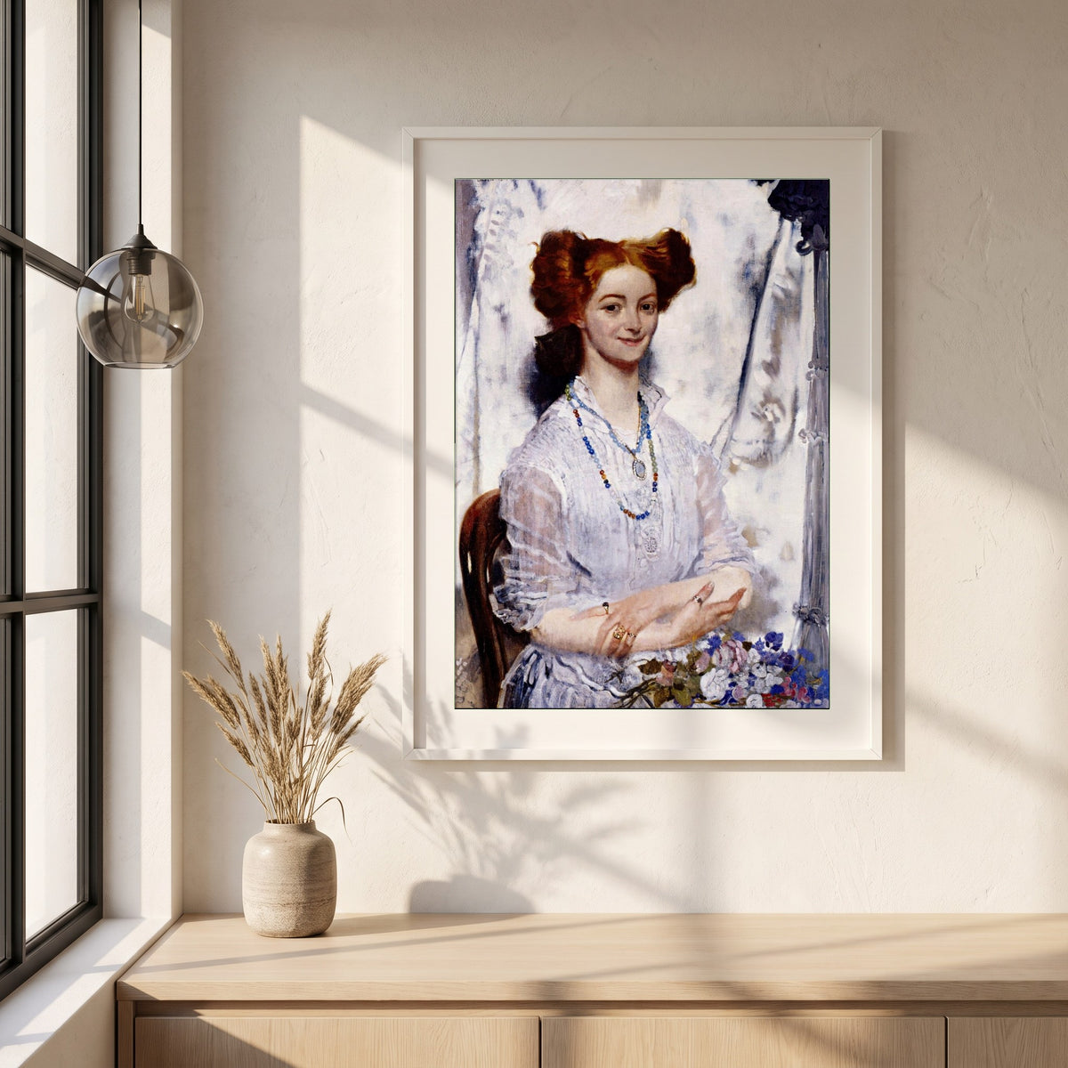 Young Ireland framed print in a white frame on a plaster wall above an oak worktop in a bright Scandinavian kitchen